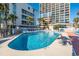 Large outdoor pool surrounded by lounge chairs and palm trees, perfect for relaxation and recreation at 5523 North Ocean Blvd. # 1903, Myrtle Beach, SC 29577