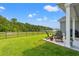 Inviting back yard offers a covered patio and green space with peaceful views at 5605 Whitebark Dr., Myrtle Beach, SC 29577