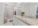 Elegant bathroom with double vanity, granite countertops, and glass shower at 5605 Whitebark Dr., Myrtle Beach, SC 29577