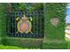 Community entrance sign with decorative metal gate, and lush landscaping at 5605 Whitebark Dr., Myrtle Beach, SC 29577