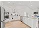 Modern kitchen featuring stainless steel appliances, granite countertops, and ample white cabinetry at 5605 Whitebark Dr., Myrtle Beach, SC 29577