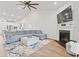 Cozy living room with fireplace, comfortable seating, and an open view into the modern kitchen at 5605 Whitebark Dr., Myrtle Beach, SC 29577