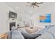 Bright living room features a fireplace, ceiling fan, and modern furnishings at 5605 Whitebark Dr., Myrtle Beach, SC 29577