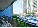 Balcony view of the parking lot and high rise building with lush landscaping at 5905 South Kings Hwy. # 116B, Myrtle Beach, SC 29575