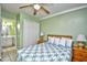 A cozy bedroom features a full bed, side tables with lamps, and access to an en-suite bathroom at 5905 South Kings Hwy. # 116B, Myrtle Beach, SC 29575