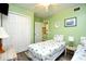 Twin bedroom with nautical bedding, fan, and closet space provides comfort and style at 5905 South Kings Hwy. # 116B, Myrtle Beach, SC 29575