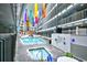 Indoor pool and hot tub with colorful hanging banners, seating, and a shallow pool for children at 5905 South Kings Hwy. # 116B, Myrtle Beach, SC 29575