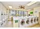 Laundry room with modern washing machines and a view of the building exterior at 5905 South Kings Hwy. # 116B, Myrtle Beach, SC 29575