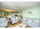 Bright and airy living room leading to the kitchen, featuring comfortable seating and stylish decor throughout the space at 5905 South Kings Hwy. # 116B, Myrtle Beach, SC 29575
