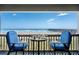 Relaxing balcony with comfortable seating and breathtaking ocean views of the pier at 6000 N Ocean Blvd. # 119, North Myrtle Beach, SC 29582