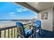 Relax on the balcony with comfortable blue chairs, and admire ocean views including the pier at 6000 N Ocean Blvd. # 119, North Myrtle Beach, SC 29582