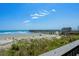 Captivating view of the beach and pier from the condo; perfect for a serene coastal lifestyle at 6000 N Ocean Blvd. # 119, North Myrtle Beach, SC 29582