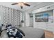 Cozy bedroom featuring a ceiling fan, calming light-blue paint, and a flatscreen TV at 6000 N Ocean Blvd. # 119, North Myrtle Beach, SC 29582