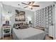 Serene bedroom with calming decor, patterned curtains, and cozy furnishings at 6000 N Ocean Blvd. # 119, North Myrtle Beach, SC 29582