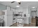 Clean and functional kitchen with white cabinets, modern appliances, and a convenient serving cart at 6000 N Ocean Blvd. # 119, North Myrtle Beach, SC 29582