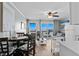 Inviting living room and dining area with ocean view, creating a perfect space for relaxation and entertaining at 6000 N Ocean Blvd. # 119, North Myrtle Beach, SC 29582