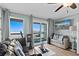 Cozy living room with ocean view balcony access, comfortable seating, and stylish decor at 6000 N Ocean Blvd. # 119, North Myrtle Beach, SC 29582