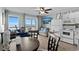 Bright living space with ocean views, balcony, kitchen area, dining table, and comfortable seating at 6000 N Ocean Blvd. # 119, North Myrtle Beach, SC 29582