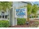 Community sign for 'Sea Cabin Cherry Grove' surrounded by beautiful landscaping and greenery at 6000 N Ocean Blvd. # 119, North Myrtle Beach, SC 29582