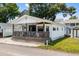 Inviting single-story home featuring a spacious front porch, ideal for relaxation at 6001-5742 S Kings Hwy., Myrtle Beach, SC 29575