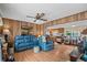 Cozy living room featuring wood paneling, comfortable seating, and open layout at 6001-5742 S Kings Hwy., Myrtle Beach, SC 29575