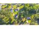 Wide aerial view of a neighborhood with mature trees and well-maintained lawns at 64 Highway 521, Andrews, SC 29510