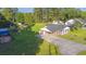 Aerial view of a brick home with a large yard and a covered carport at 64 Highway 521, Andrews, SC 29510