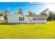 Beautiful backyard showcases the home's rear exterior, featuring a well-kept lawn and inviting outdoor spaces at 64 Highway 521, Andrews, SC 29510