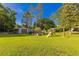 Spacious backyard with an outbuilding and a swing set at 64 Highway 521, Andrews, SC 29510