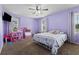 Bright bedroom featuring purple walls, carpet, a dollhouse and great natural light at 64 Highway 521, Andrews, SC 29510