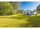 Picturesque home surrounded by lush greenery, showcasing its well-manicured lawn and serene setting at 64 Highway 521, Andrews, SC 29510