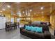 Spacious living area with wood paneled walls, comfortable seating, and kitchen access at 64 Highway 521, Andrews, SC 29510