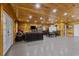 Large living area featuring wood paneling, a lounging area, and dining space at 64 Highway 521, Andrews, SC 29510