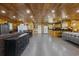 Open-concept living space with wood-paneled walls and a large island with ample counter space at 64 Highway 521, Andrews, SC 29510