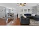 Inviting living room featuring hardwood floors, a comfortable sectional sofa, and stylish decor at 64 Highway 521, Andrews, SC 29510