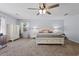 Spacious main bedroom with a ceiling fan, carpet floors, and natural light from the window at 64 Highway 521, Andrews, SC 29510