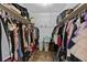 Organized walk-in closet with ample storage for clothes, shoes, and accessories on shelving at 64 Highway 521, Andrews, SC 29510