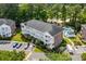 Aerial view of building showing the parking area and nearby pool at 682 Riverwalk Dr. # 102, Myrtle Beach, SC 29579