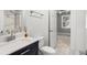Bathroom showcasing a vanity with white countertop, stainless steel faucet and fixtures, toilet, and view of bedroom at 682 Riverwalk Dr. # 102, Myrtle Beach, SC 29579