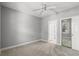 Bedroom featuring a ceiling fan, neutral paint, carpeted floors, and closet at 682 Riverwalk Dr. # 102, Myrtle Beach, SC 29579