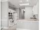Well-lit kitchen featuring white cabinets and granite countertops at 682 Riverwalk Dr. # 102, Myrtle Beach, SC 29579
