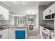 Bright, open kitchen flowing into the living space with views to the backyard at 682 Riverwalk Dr. # 102, Myrtle Beach, SC 29579