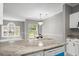 Open-concept space with a view of a bright living room and sliding glass doors to the backyard at 682 Riverwalk Dr. # 102, Myrtle Beach, SC 29579