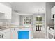 Bright living space with a large arched window and access to the backyard deck at 682 Riverwalk Dr. # 102, Myrtle Beach, SC 29579