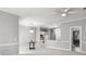 Open living and dining area with a chandelier and views into the kitchen at 682 Riverwalk Dr. # 102, Myrtle Beach, SC 29579