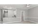 Living room featuring a ceiling fan and open access to the kitchen at 682 Riverwalk Dr. # 102, Myrtle Beach, SC 29579