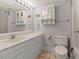Bright bathroom featuring a white vanity, tiled floors, and a matching toilet for a clean and classic design at 7000 N Ocean Blvd. # 427, Myrtle Beach, SC 29572