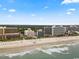 Scenic beachfront with multiple resort buildings, offering direct access to the sand, ocean views, and a tranquil setting at 7000 N Ocean Blvd. # 427, Myrtle Beach, SC 29572