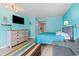 Bright bedroom featuring stylish decor, comfortable queen bed, and a sitting area at 7000 N Ocean Blvd. # 427, Myrtle Beach, SC 29572
