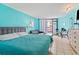 Bright bedroom featuring stylish decor, comfortable queen bed, and access to the balcony at 7000 N Ocean Blvd. # 427, Myrtle Beach, SC 29572